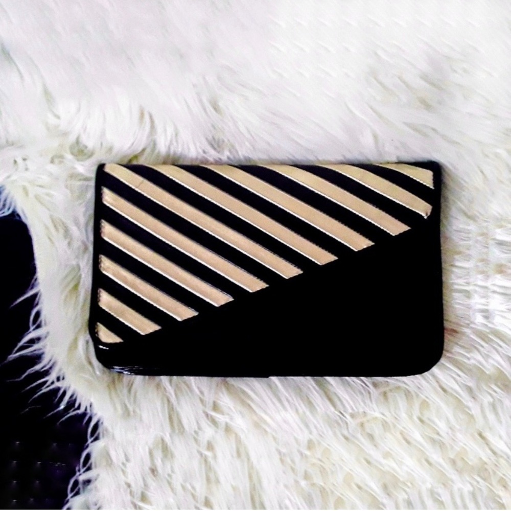 black and gold striped diagonal flap clutch